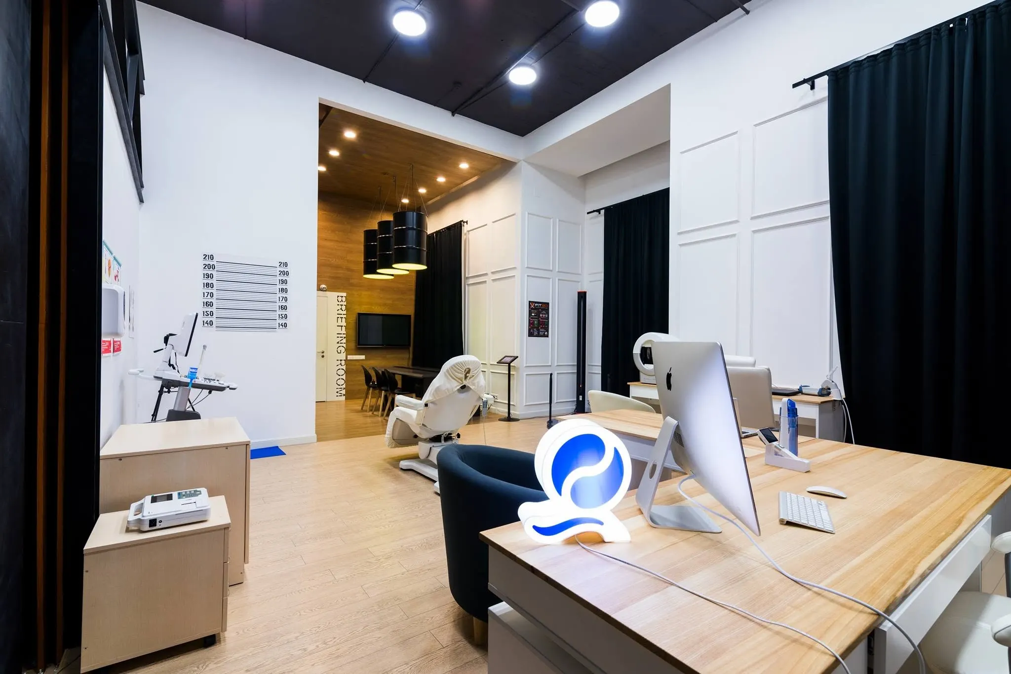 Interior of SQLAB, Ukraine's first biohacking clinic — diagnostic equipment and a consultation desk.